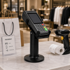 PS-70 compact POS stand deployed at 24-hour minimart checkout counter holding payment terminal for high-frequency transactions