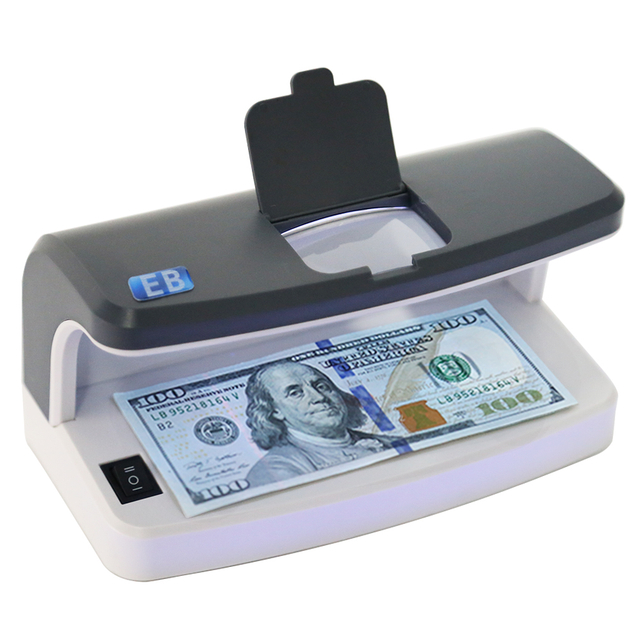 DC-5100 UV MG bank-grade banknote detector front view with built-in magnifier and rechargeable battery design